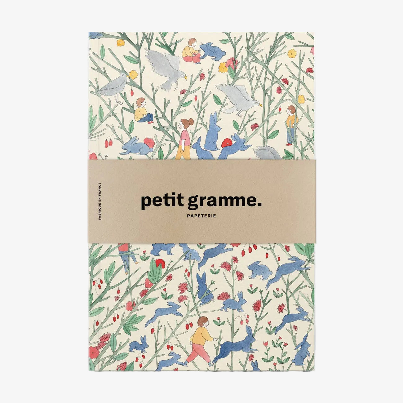 Notebook with a colorful animal pattern and 'petit gramme' branding on a white background