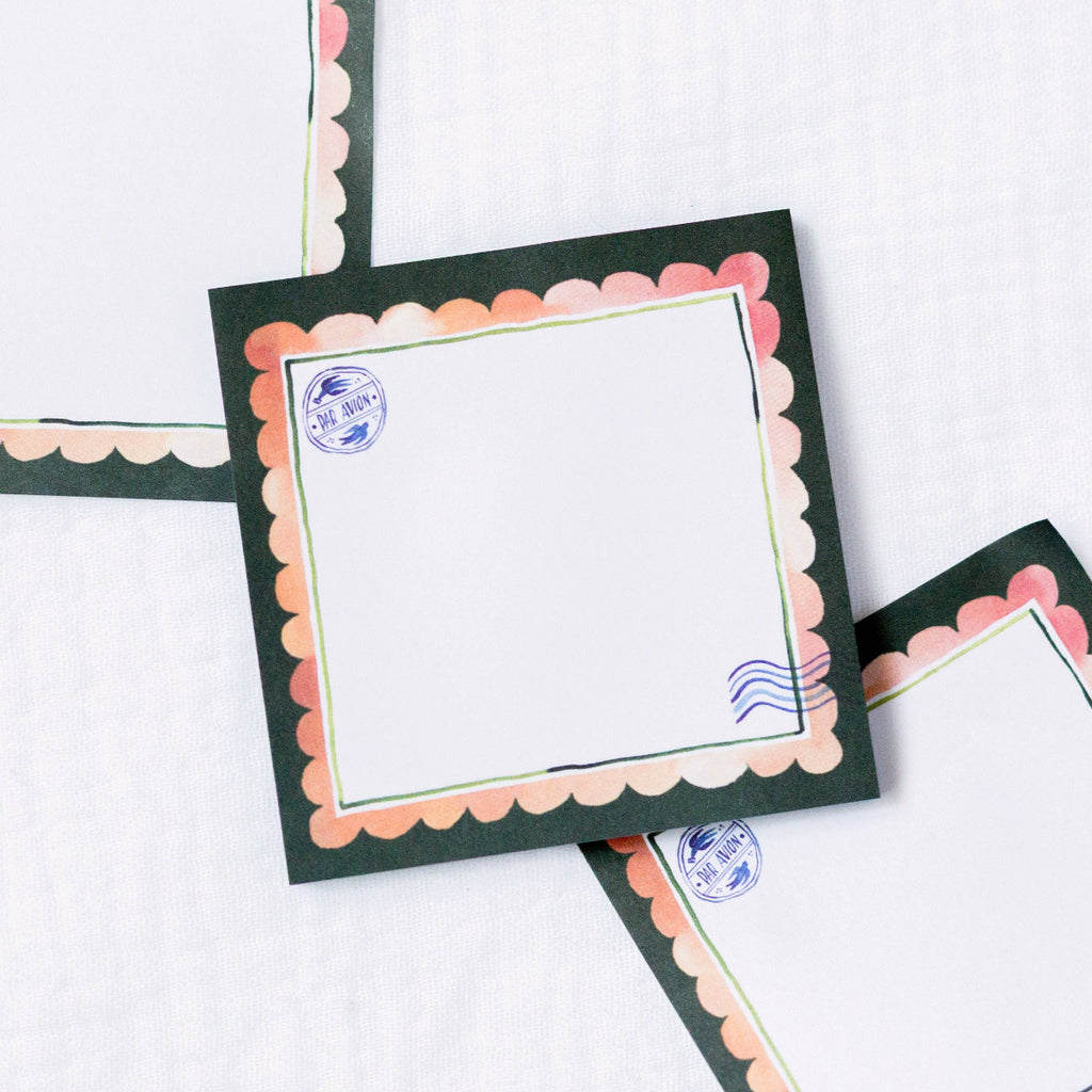 Decorative sticky notes with scalloped edges and postage stamp designs on a white background
