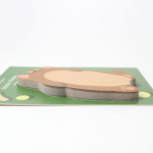 Dog-shaped sticky notes on a green base with a white background
