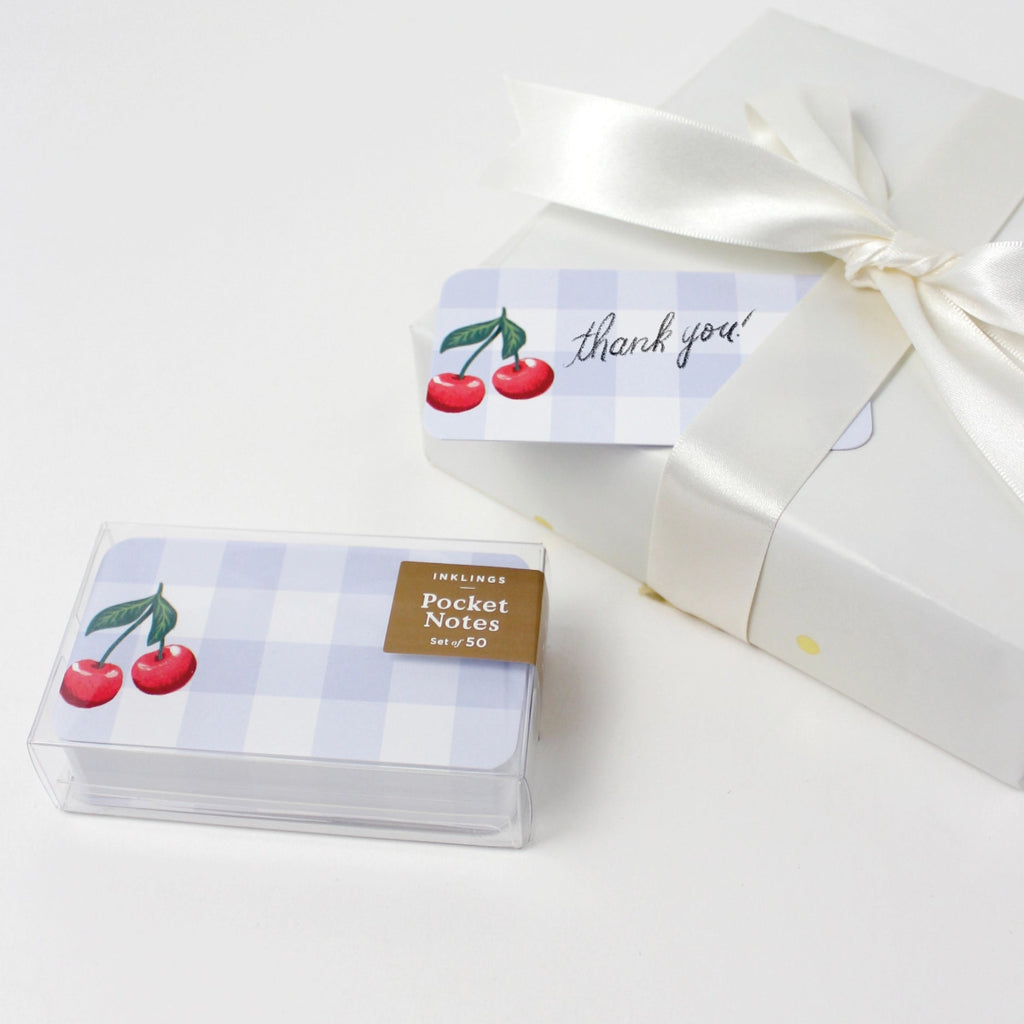 Pack of pocket notes with cherry design and 'thank you' label on a white background