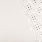 A close-up of a white textured surface split diagonally, with the right side showing a repeating pattern of small black dots.