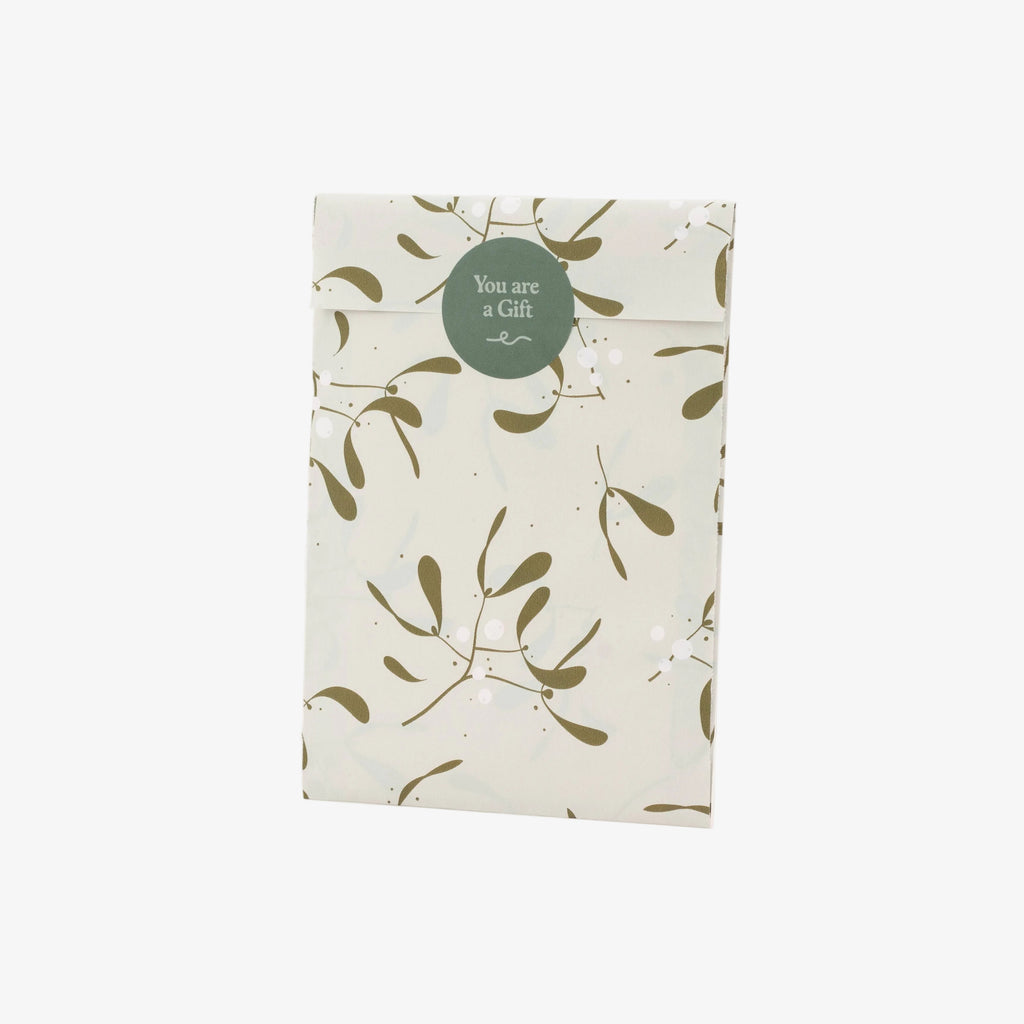 Packaged product with leaf pattern and 'You are a Gift' tag on a white background