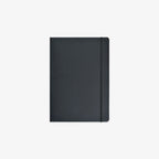 A minimalist black hardcover notebook with an elastic closure band, shown flat against a light gray background.