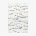 Softcover notebook with wavy blue pattern on a white background