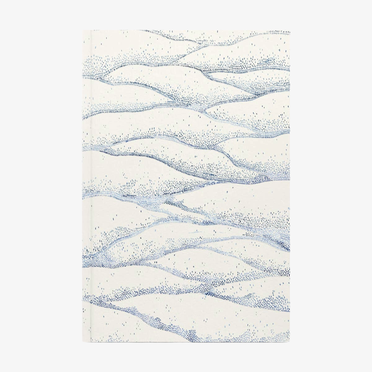 Softcover notebook with wavy blue pattern on a white background