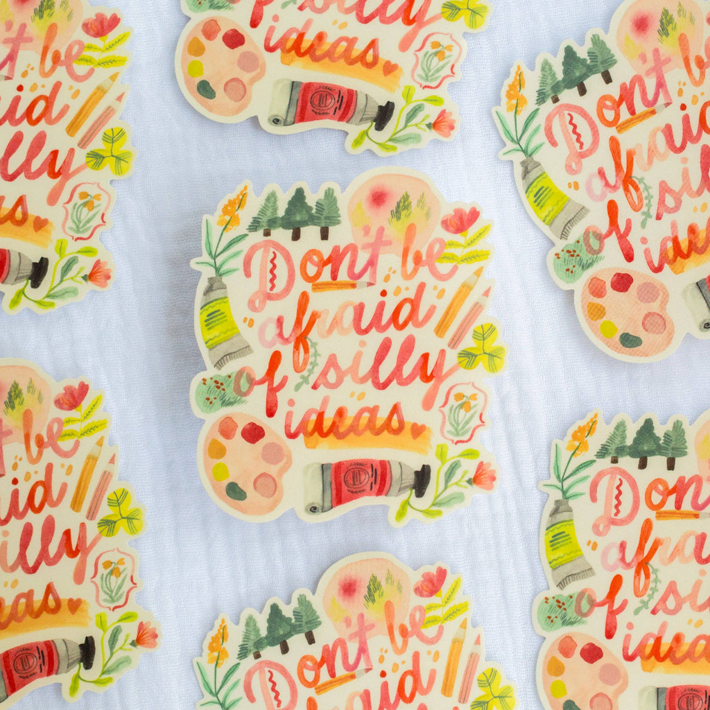 Colorful stickers with motivational phrases on a light background