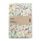 Notebook with colorful animal illustrations on a white background