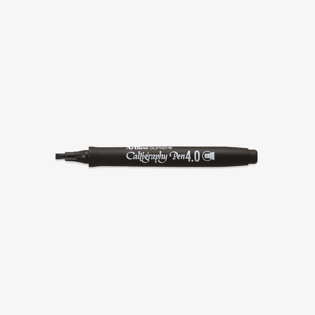 Black calligraphy pen on a white background