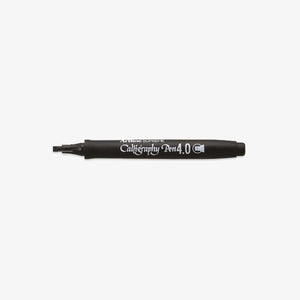 Black calligraphy pen on a white background