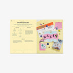 Open book with holiday-themed pages featuring 'Bali' and travel-themed illustrations on a white background.