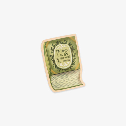 Book-shaped vinyl sticker with 'Things I was supposed to know' text on a white background