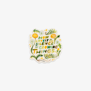 A die-cut sticker featuring the quote 'HOW LOVELY IS THE SILENCE OF GROWING THINGS.' in green and yellow lettering, surrounded by watercolor-style green leaves, yellow flowers, and small white dots on a white background.