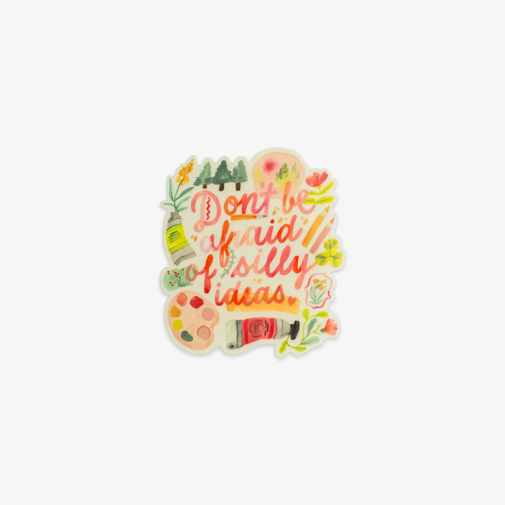 Colorful sticker with 'Don't be afraid of silly ideas' text on a lightgrey background.