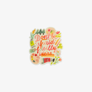 Colorful sticker with 'Don't be afraid of silly ideas' text on a lightgrey background.