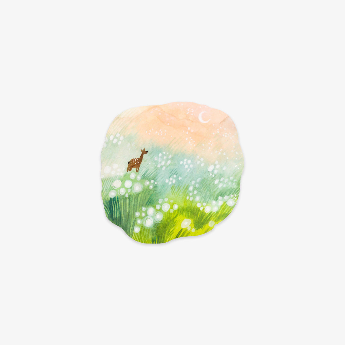 A die-cut sticker featuring a whimsical watercolor landscape with a deer standing in a field of glowing white flowers under a soft peach and green sky with a small crescent moon.