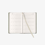 Open daily planner with a ribbon bookmark