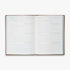 Open book from our Three Year Journal with the daily prompts on a white background