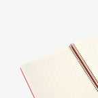 Open notebook with lined pages on a white background