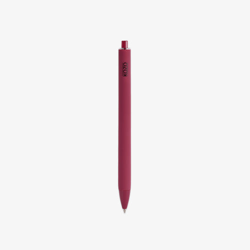 Red pen with a visible brand logo AND BLACK INK