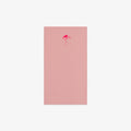 Pink notebook with a palm tree logo on a white background