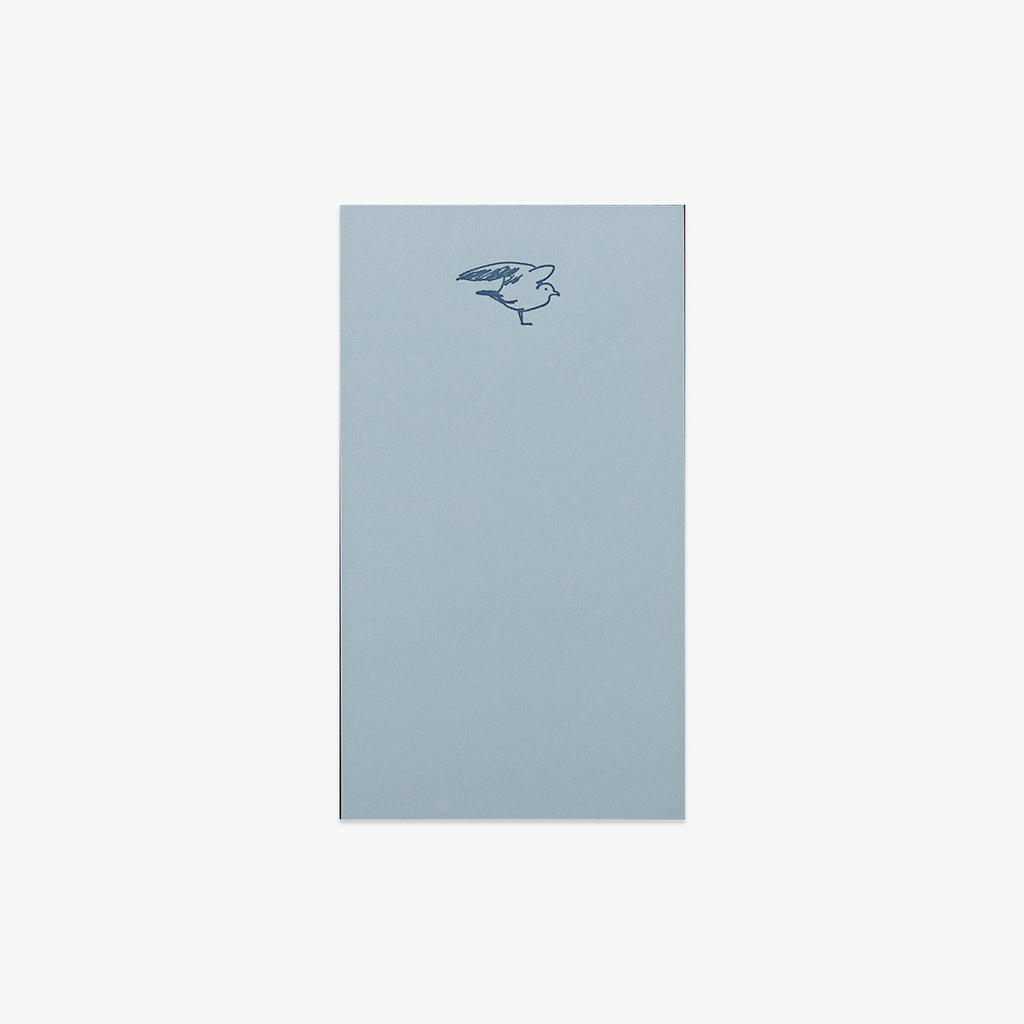 Light blue notepad with a bird illustration on a white background