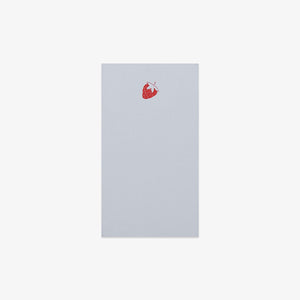 light blue notepad with a pink strawberry on a white background