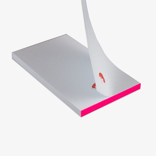 light blue notepad with a pink strawberry on a white background