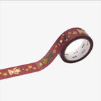 Decorative christmas-themed masking tape with teddy bear and star pattern on a white background