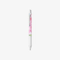 White pen with a pink floral moomin design on a white background