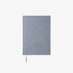 Blue fabric-bound notebook on a white background