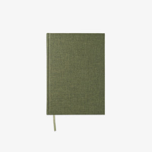Green notebook with a textured cover 