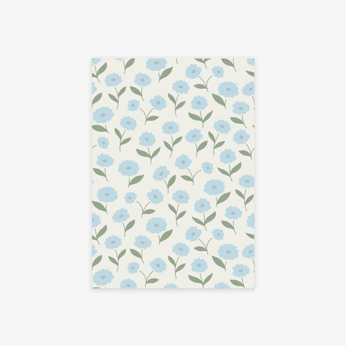 A rectangular sheet of paper with a repeating floral pattern of light blue flowers and green leaves on an off-white background, shown against a light gray studio backdrop.