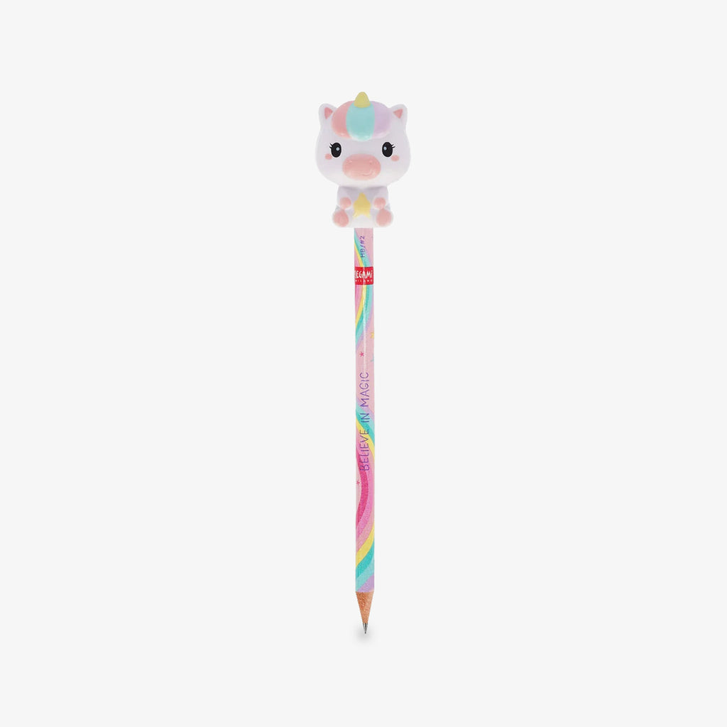 A pastel-colored pencil with a cute cartoon unicorn squishy character on top, set against a plain light gray background.