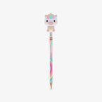 A pastel-colored pencil with a cute cartoon unicorn squishy character on top, set against a plain light gray background.