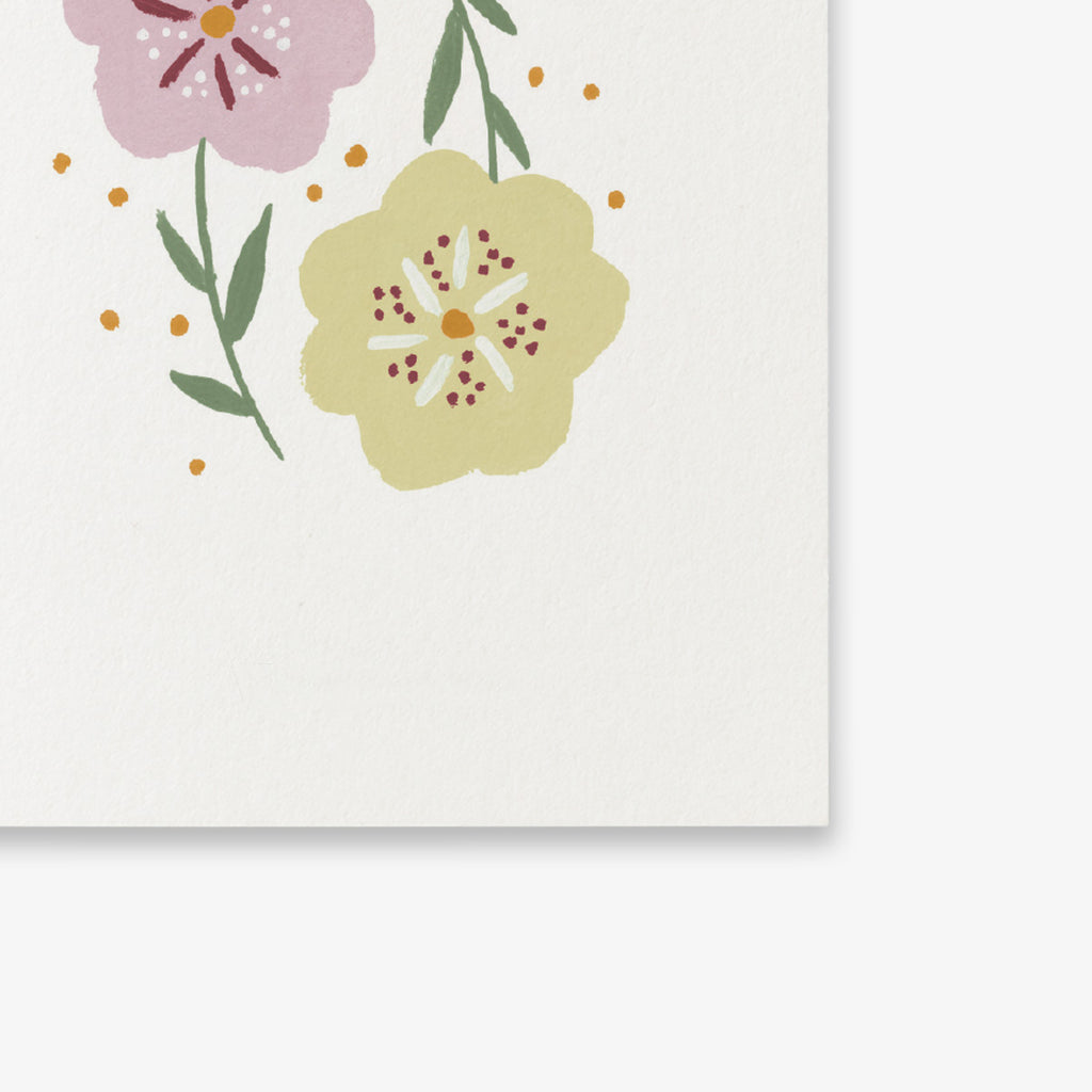 Floral design with pink and yellow flowers on a white background