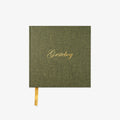 Green guestbook with gold text 'Gæstebog' on a white background