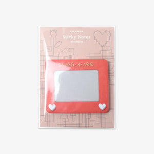 Rectangular sticky notes with a pink border and white hearts on a patterned background