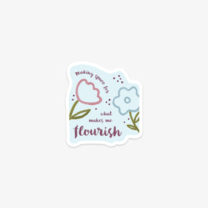 Vinyl sticker with floral design and motivational text on a light blue background