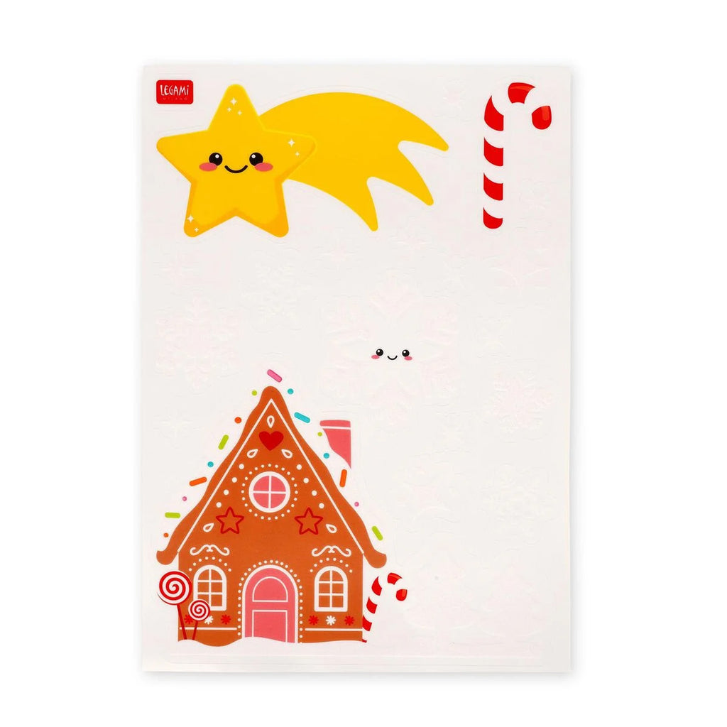Sheet of Christmas-themed window stickers with a gingerbread house, candy cane, and star design on a white background.