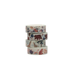 Four rolls of decorative tape with various animal patterns on a white background