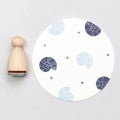 Shell stamp pad with blue and gray Shell stamps on a white background