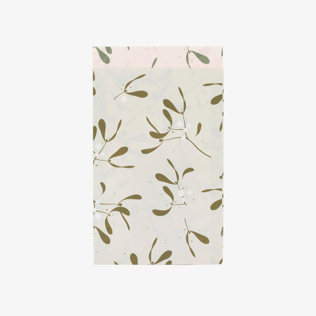 Paper bag with a green leaf pattern on a white background