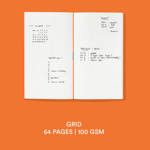 An open grid planner or notebook shown on a solid orange background, with handwritten notes on the pages and text below reading 'GRID 64 PAGES | 100 GSM'.