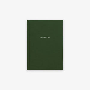 A green, hardcover cloth-bound notebook with the word 'JOURNEYS' printed on the cover in capital letters.